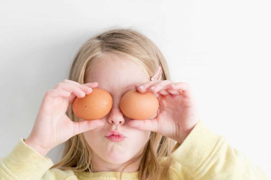 girl with eggs over eyes for easter Essex family events